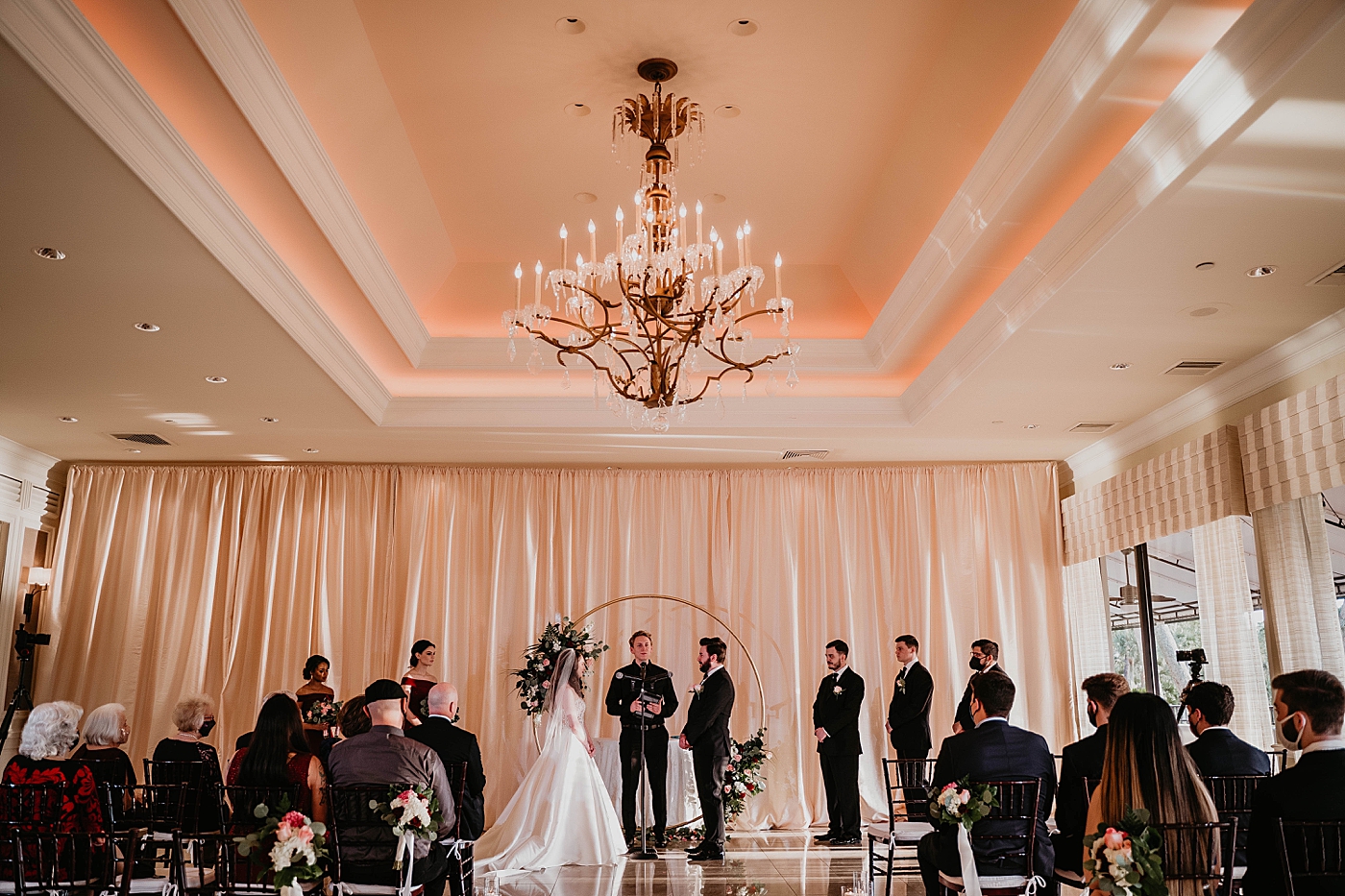 Wide shot of Ceremony homily Bride and Groom looking at each other Breakers West Wedding Photography captured by South Florida Wedding Photographer Krystal Capone Photography 