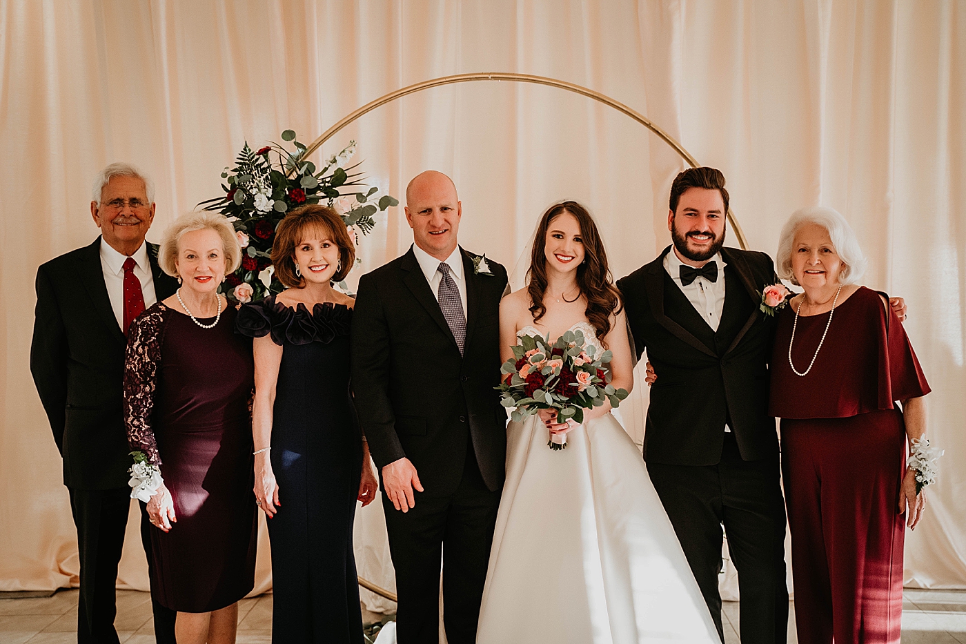 Family portrait with Bride and Groom Breakers West Wedding Photography captured by South Florida Wedding Photographer Krystal Capone Photography 