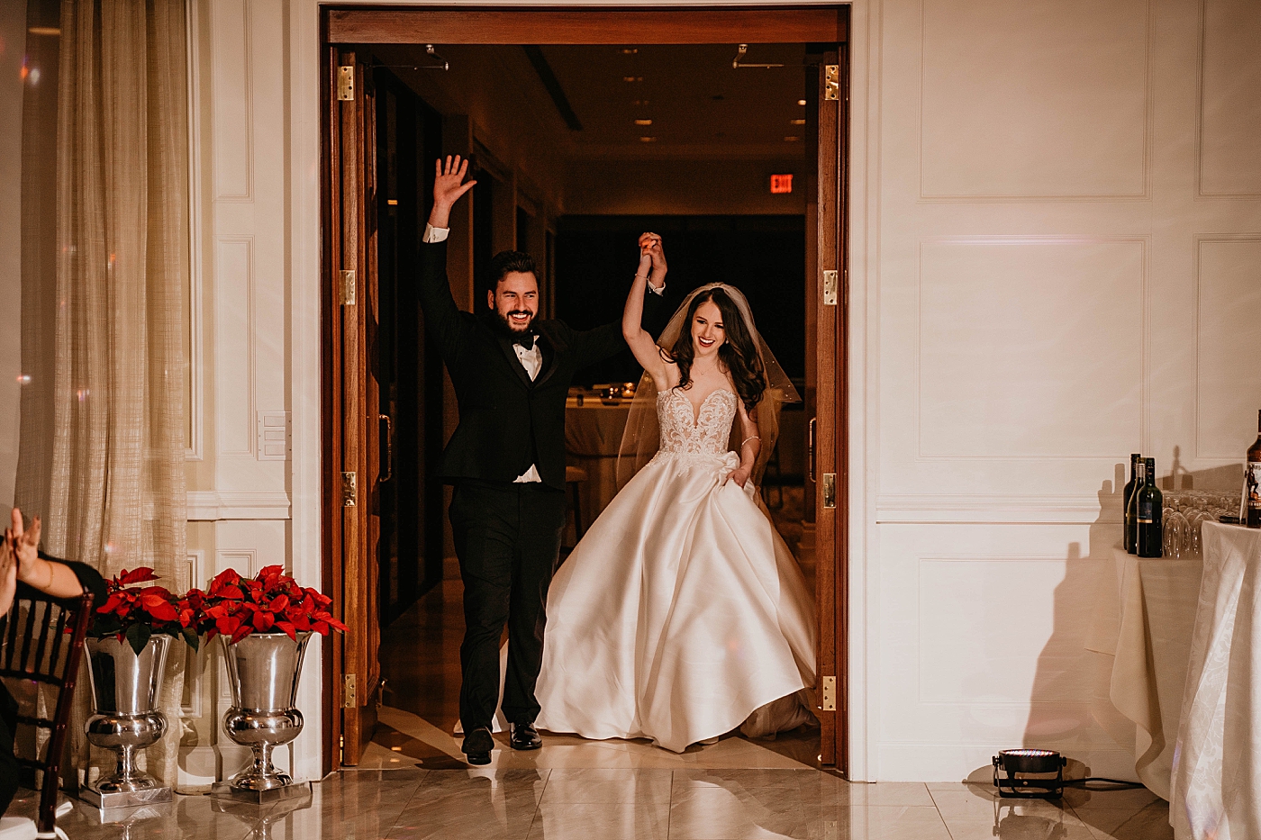 Bride and Groom entering Reception Breakers West Wedding Photography captured by South Florida Wedding Photographer Krystal Capone Photography 