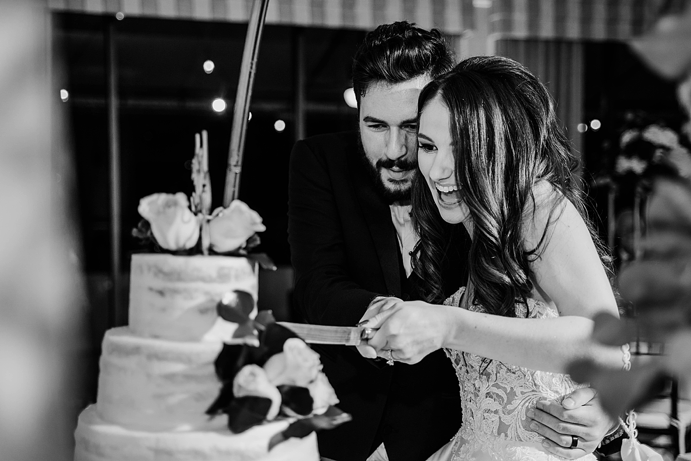 B&W Bride and Groom cutting cake Reception Breakers West Wedding Photography captured by South Florida Wedding Photographer Krystal Capone Photography 