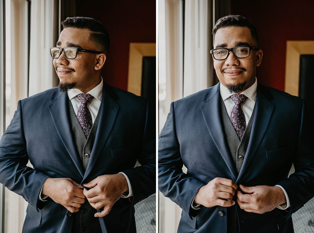 Groom getting ready buttoning jacket by window 94th Aero Squadron Miami Wedding Photography captured by South Florida Engagement Photographer Krystal Capone Photography 
