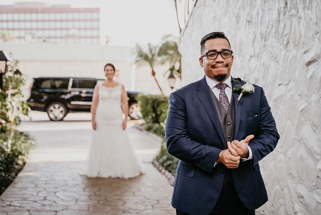 Groom with back turned to Bride for first look 94th Aero Squadron Miami Wedding Photography captured by South Florida Engagement Photographer Krystal Capone Photography 