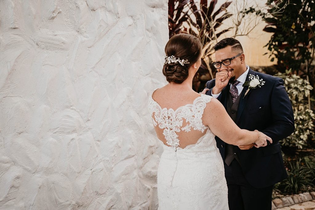Groom having an emotional reaction to seeing Bride for first look 94th Aero Squadron Miami Wedding Photography captured by South Florida Engagement Photographer Krystal Capone Photography 