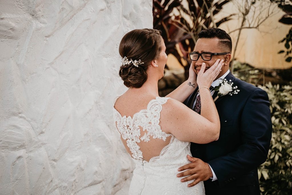Bride holding crying Groom after First Look 94th Aero Squadron Miami Wedding Photography captured by South Florida Engagement Photographer Krystal Capone Photography 