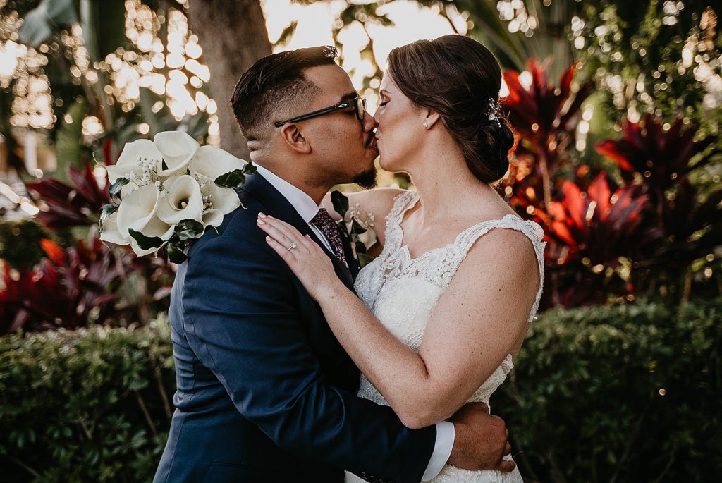 Bride and Groom kissing with white bouquet 94th Aero Squadron Miami Wedding Photography captured by South Florida Engagement Photographer Krystal Capone Photography 