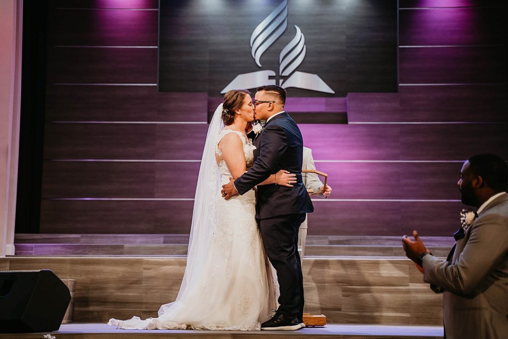 Just married Bride and Groom kissing Ceremony 94th Aero Squadron Miami Wedding Photography captured by South Florida Engagement Photographer Krystal Capone Photography 