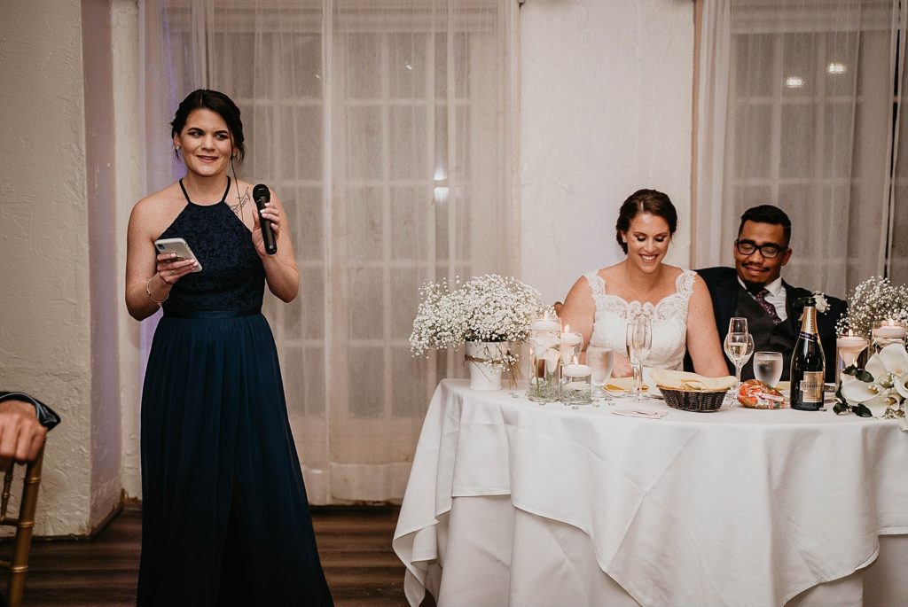 Maid of honor speech by the sweetheart table with Bride and Groom 94th Aero Squadron Miami Wedding Photography captured by South Florida Engagement Photographer Krystal Capone Photography 