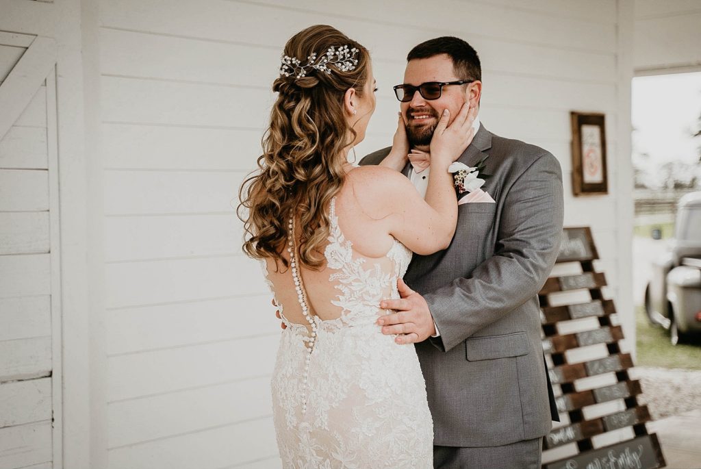 Bride and Groom holding each other after First look Ever After Farms Wedding Photography captured by South Florida Wedding Photographer Krystal Capone Photography 