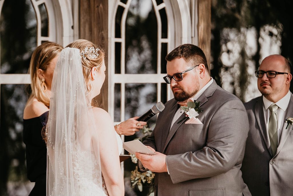Groom giving vows during Ceremony Ever After Farms Wedding Photography captured by South Florida Wedding Photographer Krystal Capone Photography 