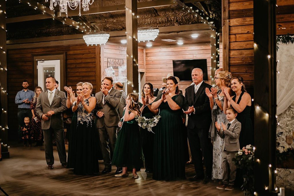 Guests watching first dance and clapping for couple Ever After Farms Wedding Photography captured by South Florida Wedding Photographer Krystal Capone Photography 