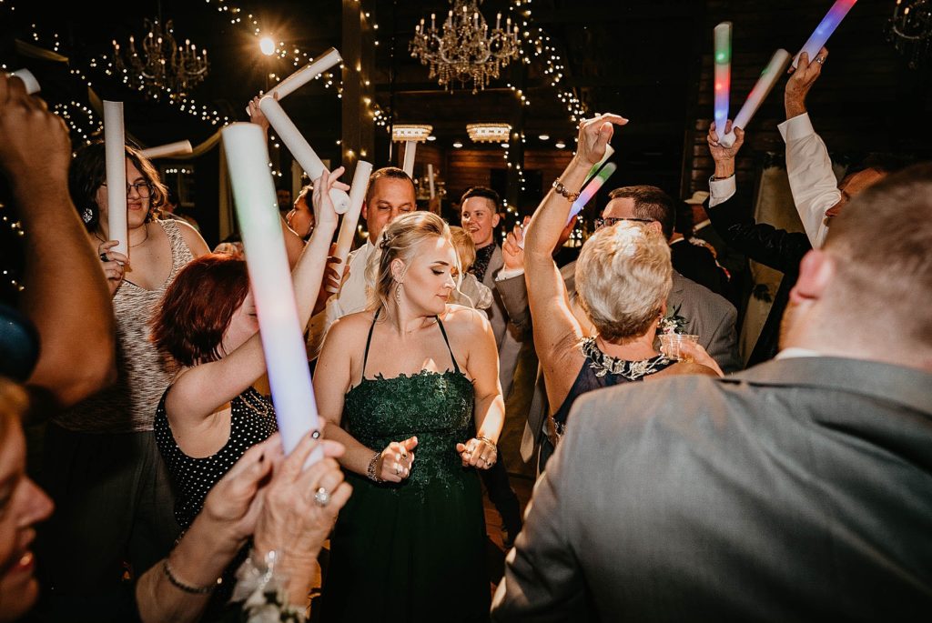 Guests having fun dancing at Reception Ever After Farms Wedding Photography captured by South Florida Wedding Photographer Krystal Capone Photography 