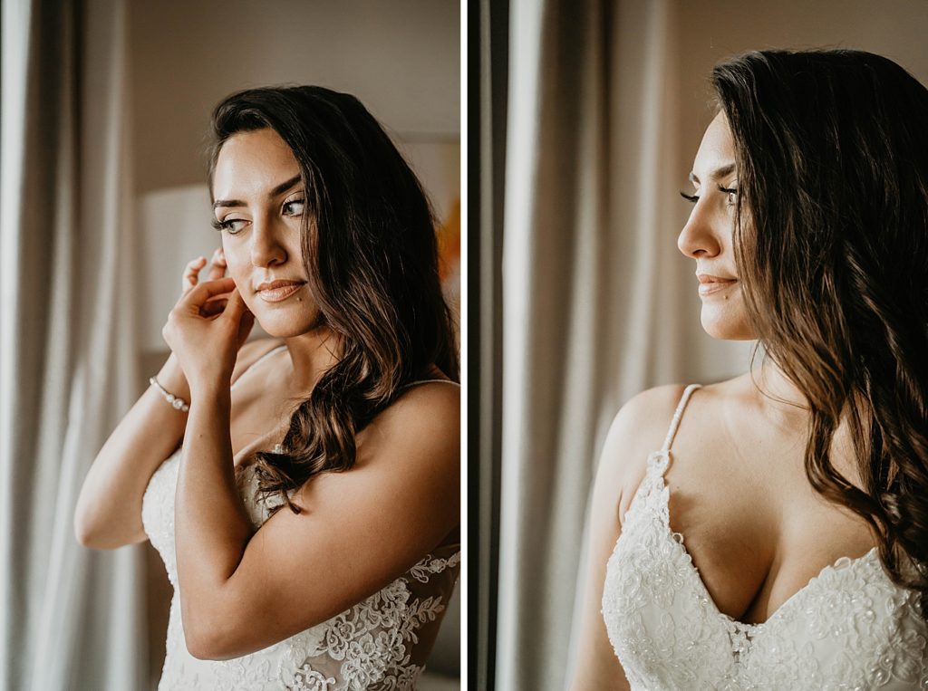 Bride putting earrings on looking out the window Hawks Cay Resort Wedding Photography captured by South Florida Wedding Photographer Krystal Capone Photography 