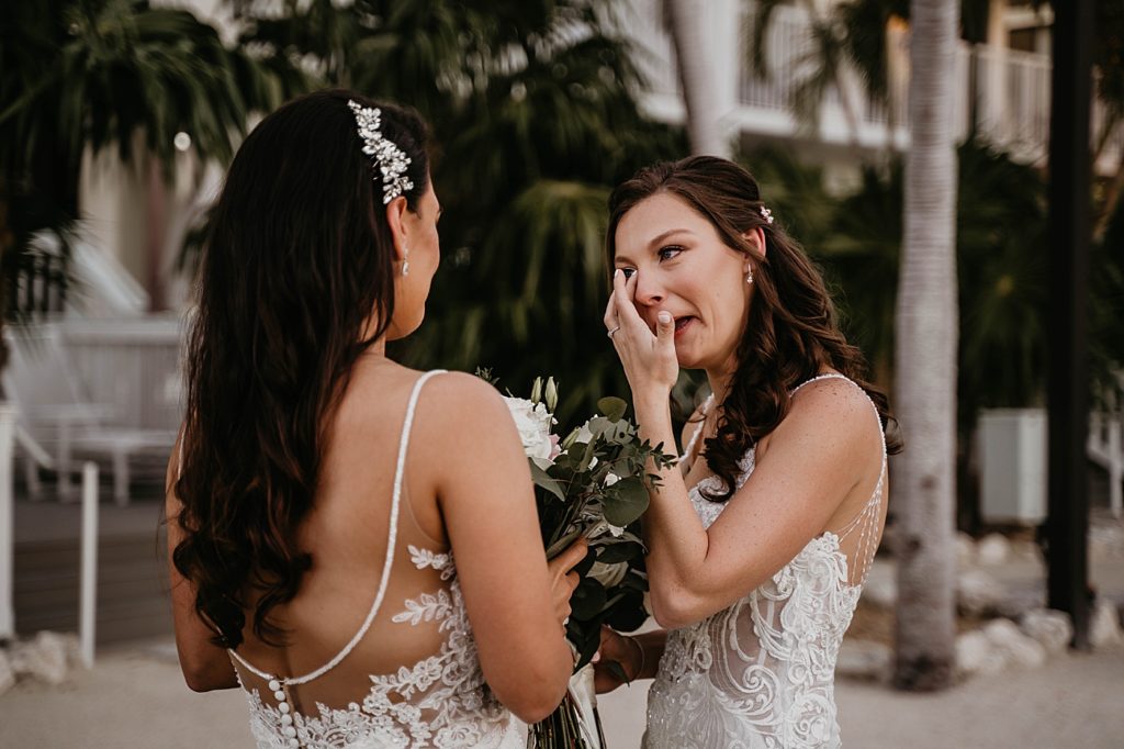 Bride reacting seeing bride for First Look LGBTQIA+ Hawks Cay Resort Wedding Photography captured by South Florida Wedding Photographer Krystal Capone Photography 