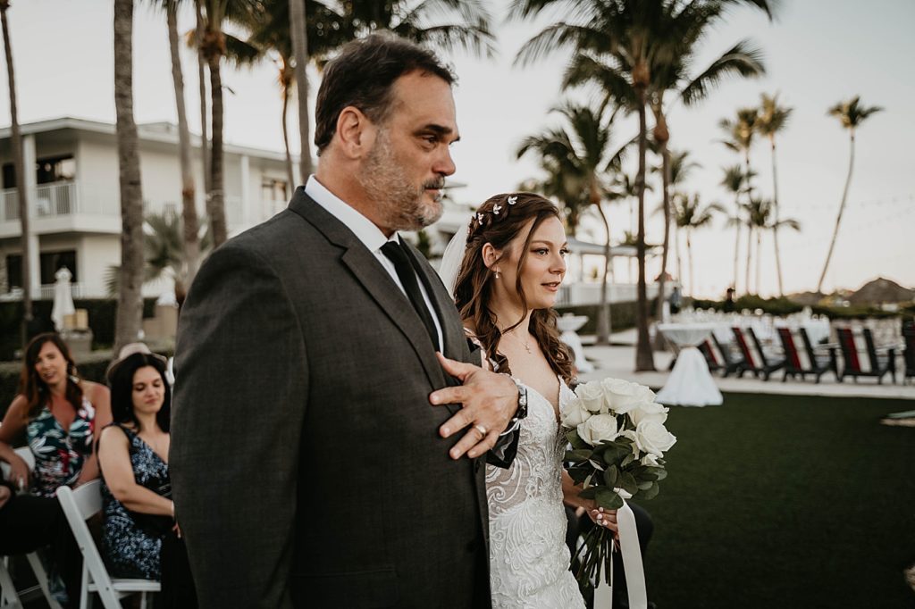 Father and Bride entering Ceremony arm in arm with white bouquet Hawks Cay Resort Wedding Photography captured by South Florida Wedding Photographer Krystal Capone Photography