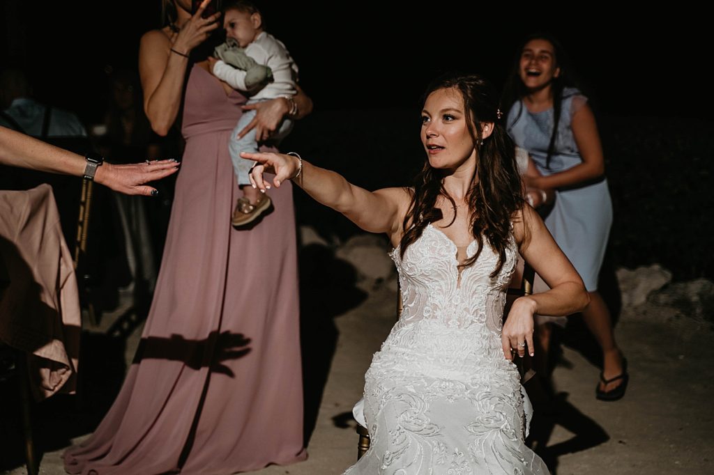 Bride having fun dancing at Reception Hawks Cay Resort Wedding Photography captured by South Florida Wedding Photographer Krystal Capone Photography