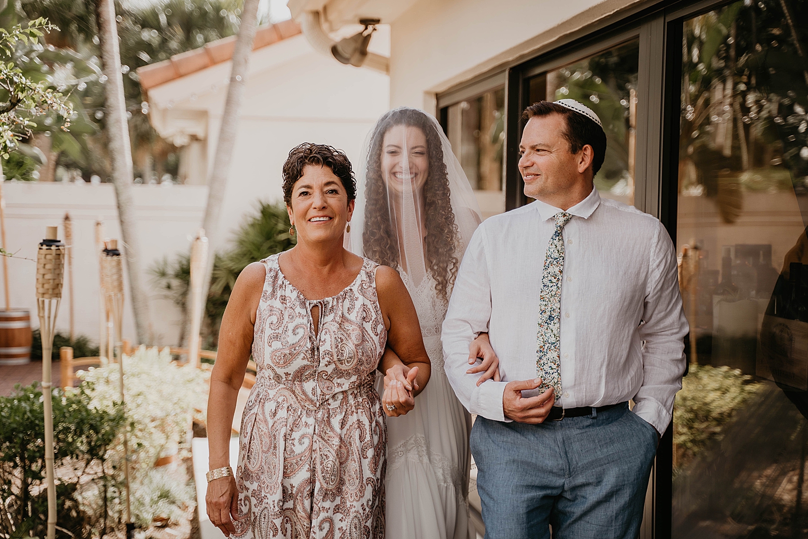 Bride entering Ceremony with mother and father Intimate South Florida Wedding Photography captured by South Florida Wedding Photographer Krystal Capone Photography 