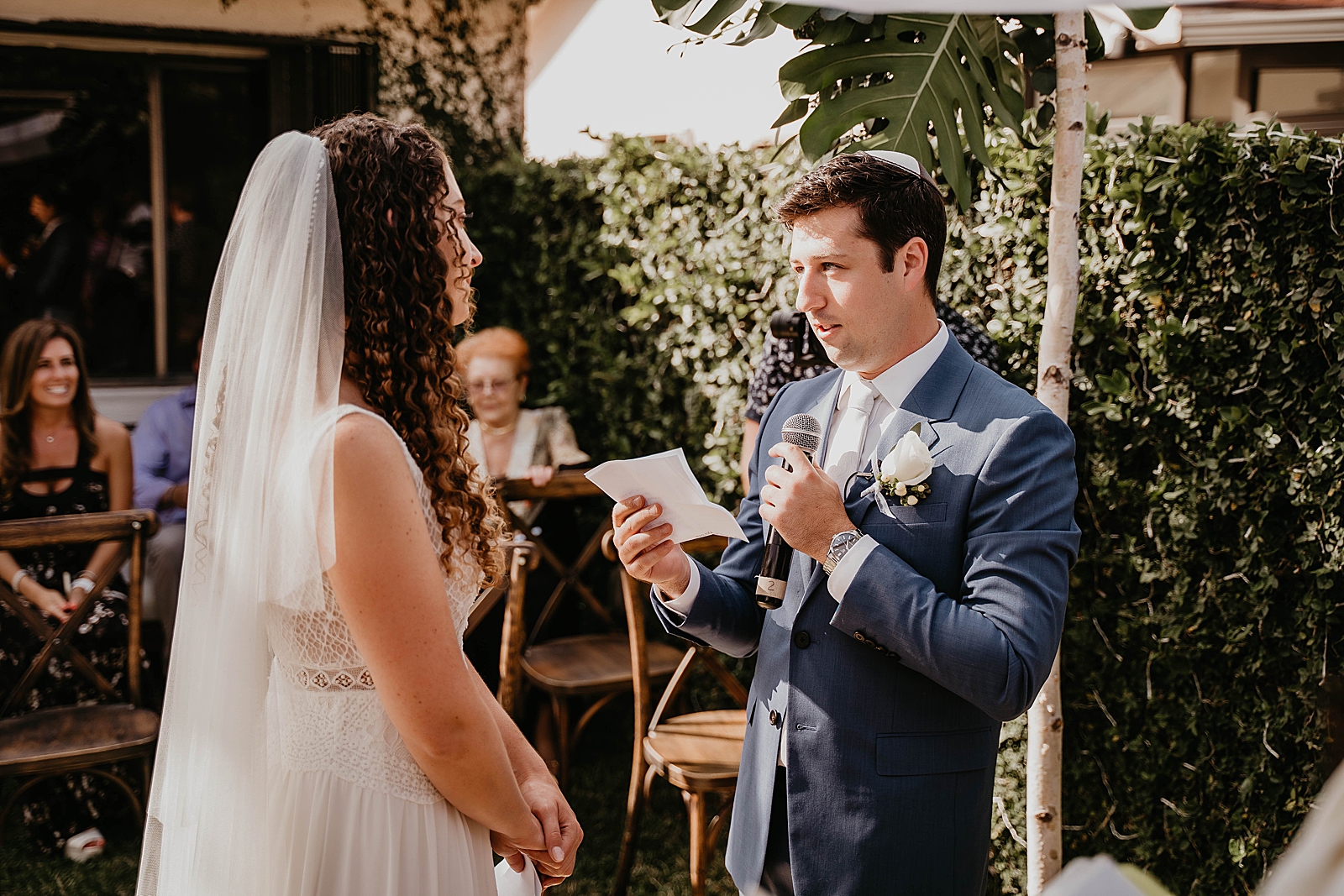 Groom telling his Ketubah to Bride during ceremony Intimate South Florida Wedding Photography captured by South Florida Wedding Photographer Krystal Capone Photography 