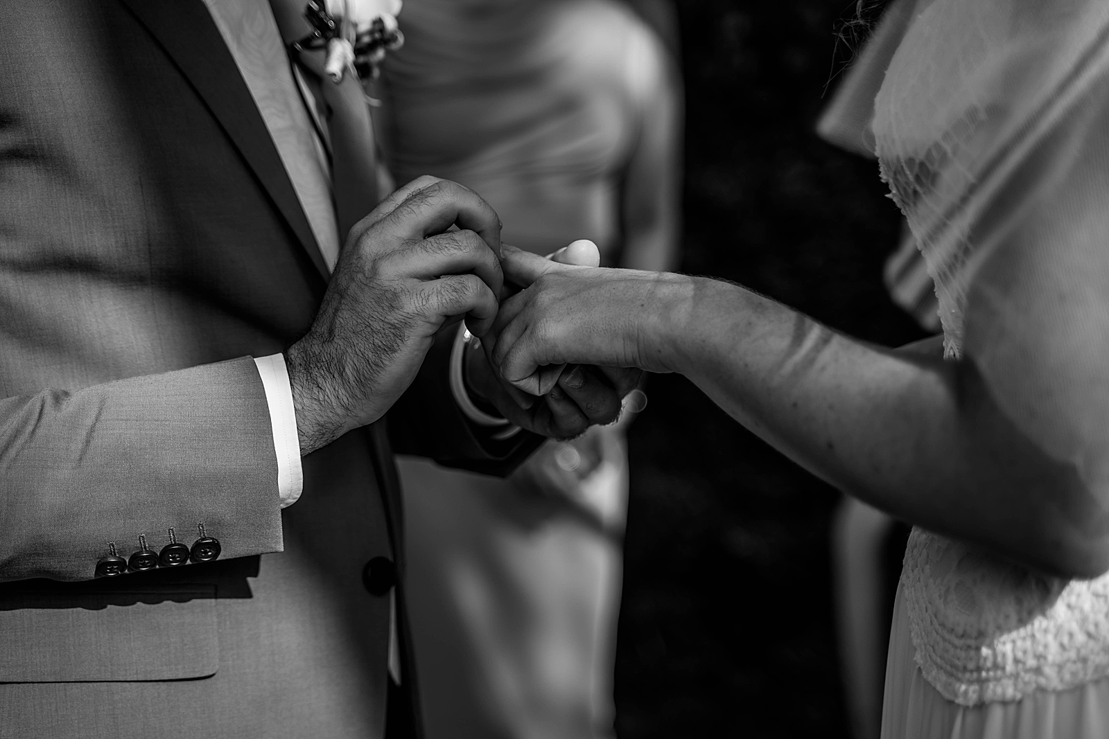 Groom putting wedding band on Bride Ceremony B&W Intimate South Florida Wedding Photography captured by South Florida Wedding Photographer Krystal Capone Photography 