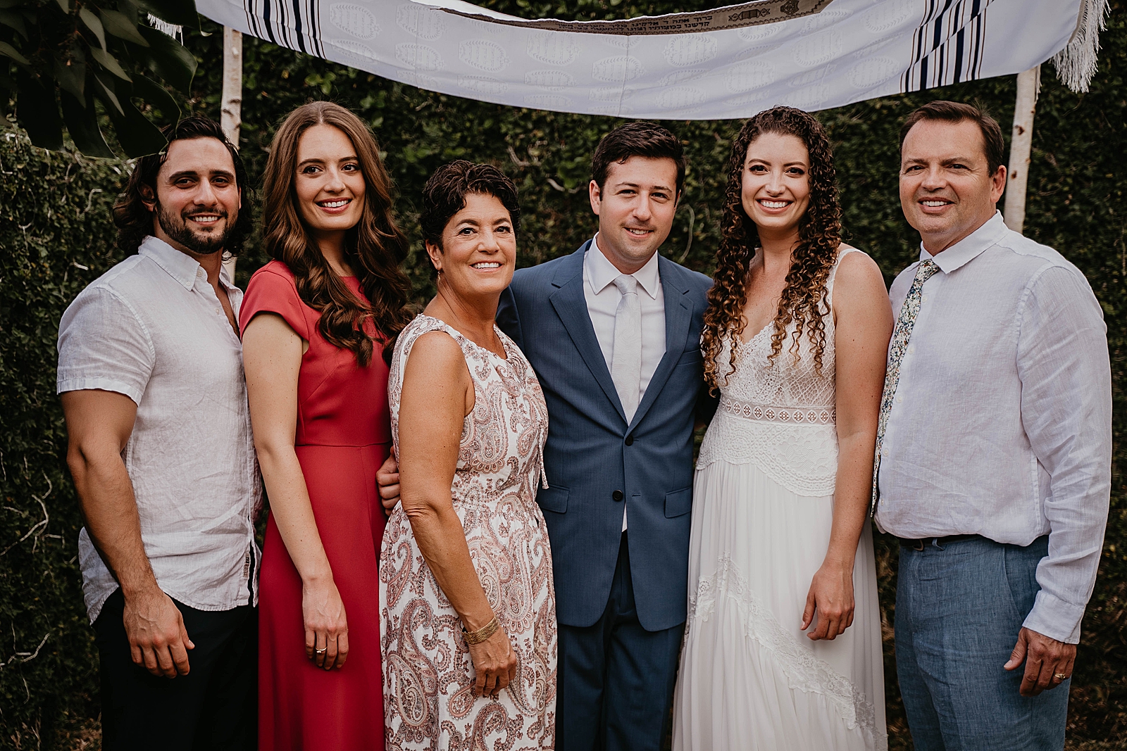 Bride and Groom with friends and family in front of Chuppah Intimate South Florida Wedding Photography captured by South Florida Wedding Photographer Krystal Capone Photography 