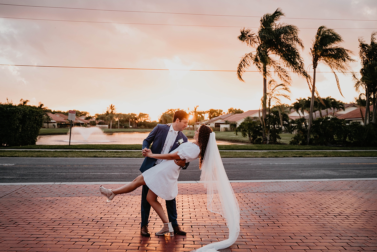 Groom dipping Bride on brick sidewalk Intimate South Florida Wedding Photography captured by South Florida Wedding Photographer Krystal Capone Photography 