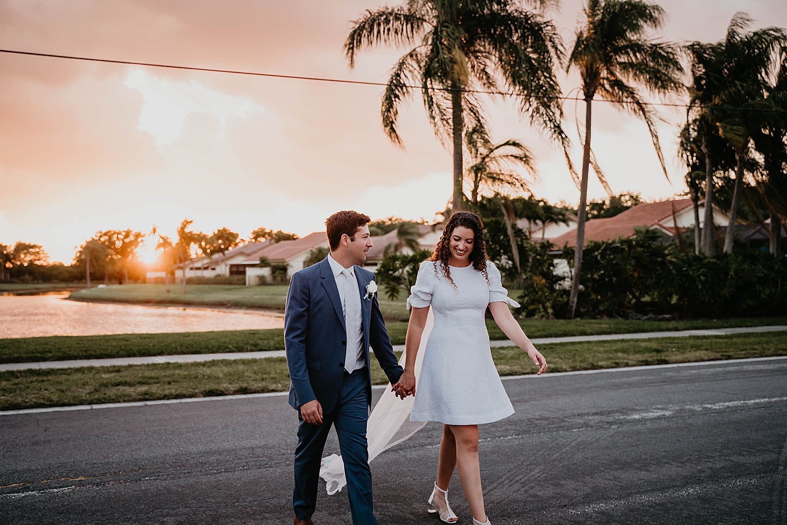 Bride and Groom holding hands crossing the street Intimate South Florida Wedding Photography captured by South Florida Wedding Photographer Krystal Capone Photography 
