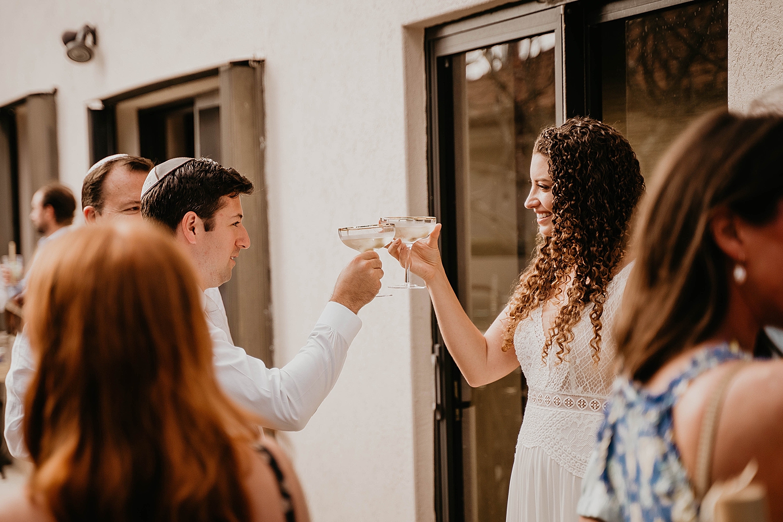 Bride and Groom cheering their glasses Reception Intimate South Florida Wedding Photography captured by South Florida Wedding Photographer Krystal Capone Photography 
