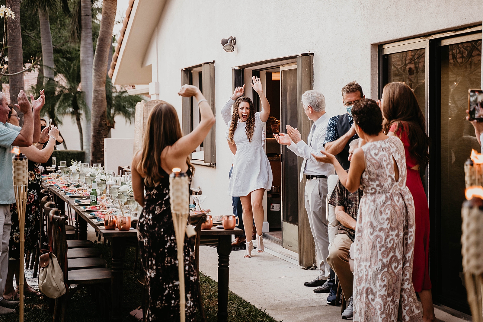 Bride and Groom entering Reception celebrating Intimate South Florida Wedding Photography captured by South Florida Wedding Photographer Krystal Capone Photography 