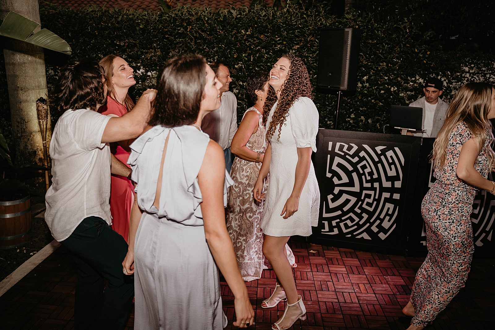 Bride dancing with friends and family at night Intimate South Florida Wedding Photography captured by South Florida Wedding Photographer Krystal Capone Photography 