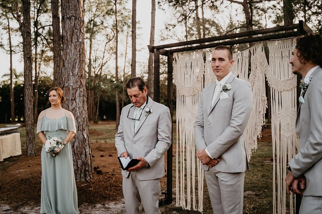 Groom standing awaiting Bride with Best man Maid of Honor and Officiant Ceremony Intimate South Florida Wedding Photography captured by South Florida Wedding Photographer Krystal Capone Photography  