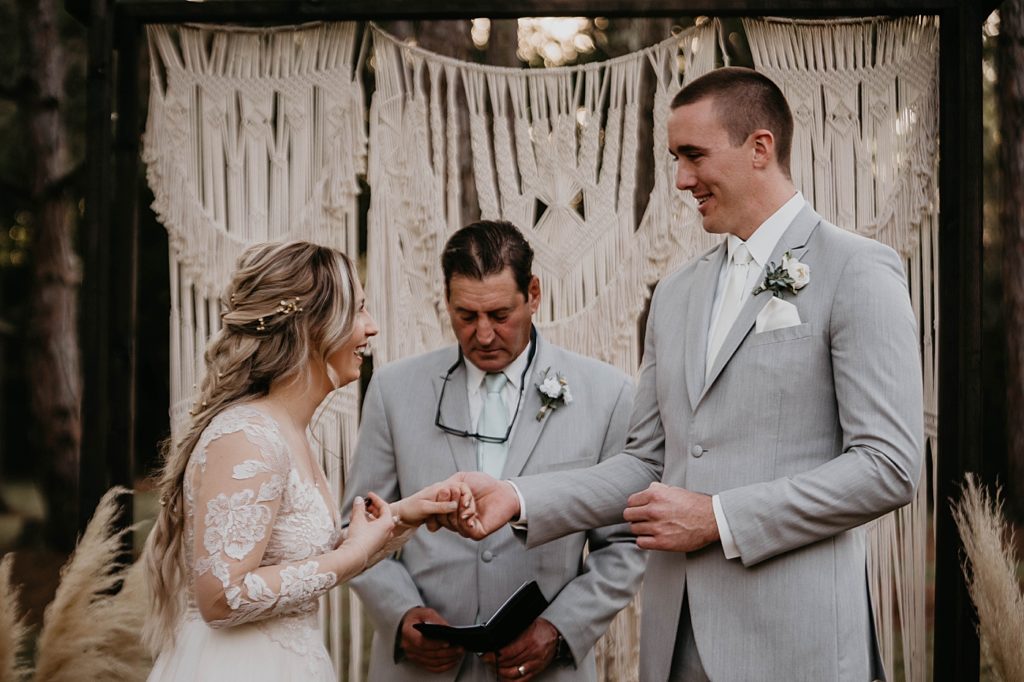 Bride and Groom holding hands during outdoor Ceremony Intimate South Florida Wedding Photography captured by South Florida Wedding Photographer Krystal Capone Photography 
