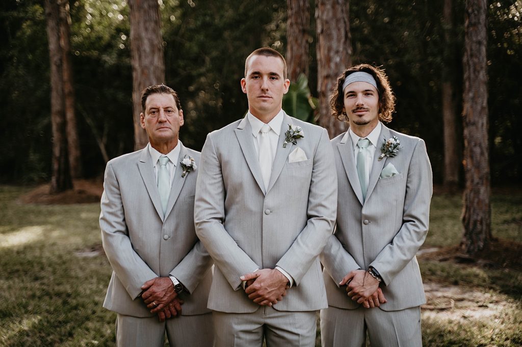 Groom with Best man and father of Bride standing formally for outdoor portrait Intimate South Florida Wedding Photography captured by South Florida Wedding Photographer Krystal Capone Photography 