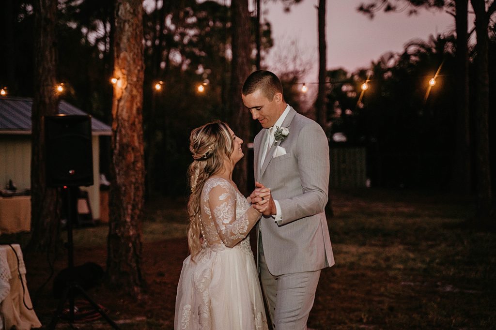 Bride and Groom First dance in the forest at night Intimate South Florida Wedding Photography captured by South Florida Wedding Photographer Krystal Capone Photography 