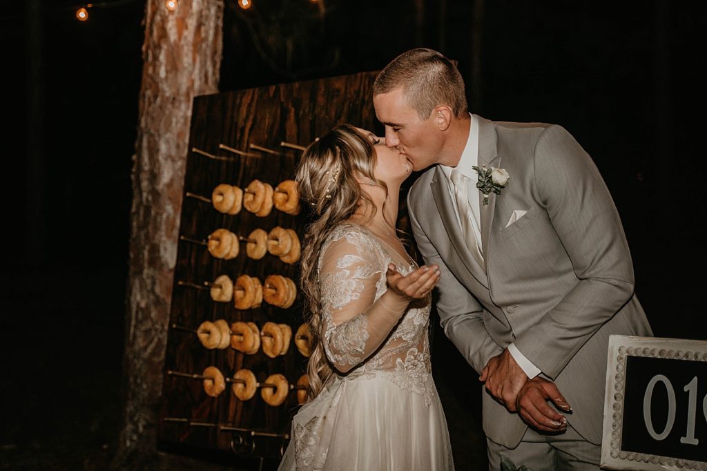 Bride and Groom kissing after cake cutting and taste Intimate South Florida Wedding Photography captured by South Florida Wedding Photographer Krystal Capone Photography 