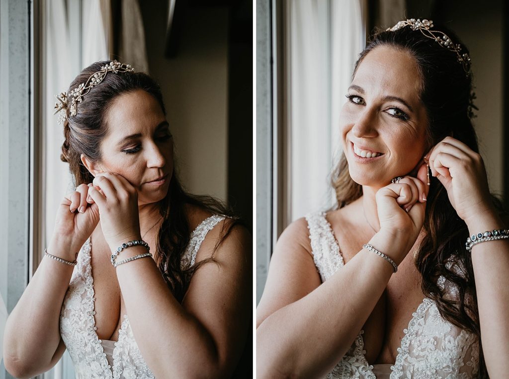 Bride getting ready putting earrings on by the window Jupiter Beach Resort Wedding Photography captured by South Florida Wedding Photographer Krystal Capone Photography 