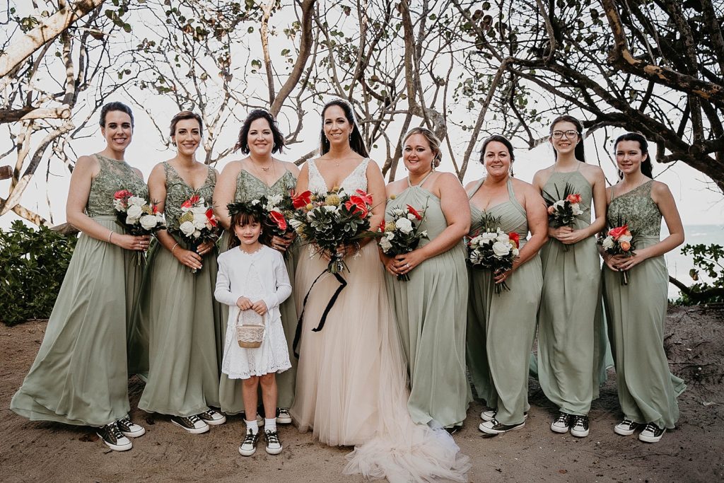 Bride Bridesmaids and flower girl standing together with bouquets in hand Jupiter Beach Resort Wedding Photography captured by South Florida Wedding Photographer Krystal Capone Photography 