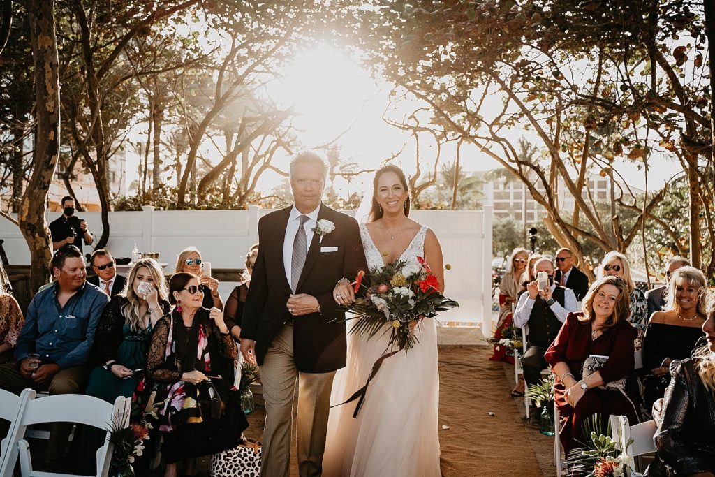 Bride and father arm in arm entering Ceremony Jupiter Beach Resort Wedding Photography captured by South Florida Wedding Photographer Krystal Capone Photography 