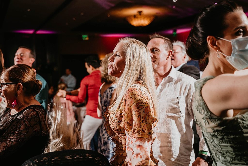 Attendees having fun at Reception Jupiter Beach Resort Wedding Photography captured by South Florida Wedding Photographer Krystal Capone Photography 