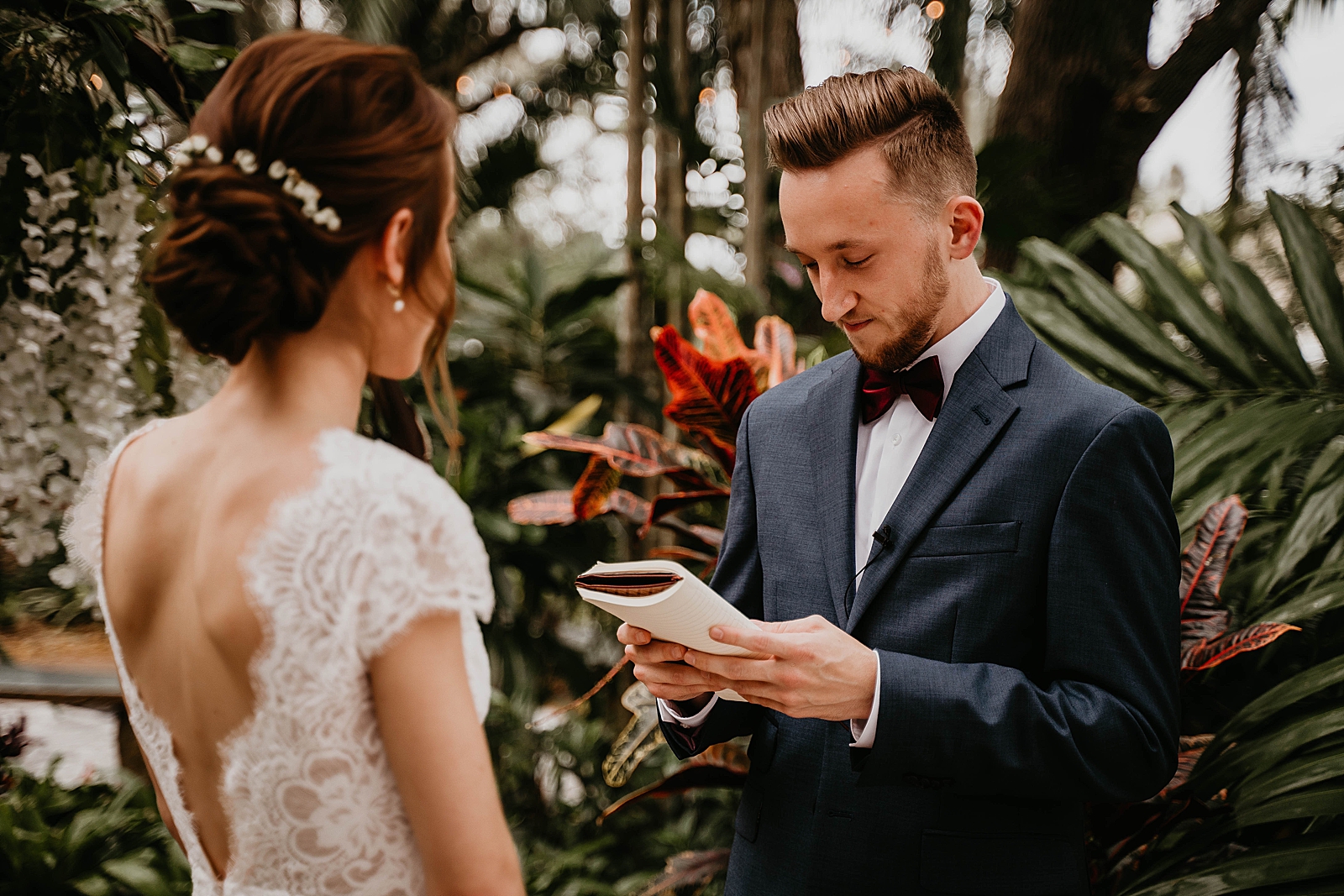 Groom reading vows to Bride after intimate first look Living Sculptures Sanctuary Wedding Photography captured by South Florida Wedding Photographer Krystal Capone Photography 