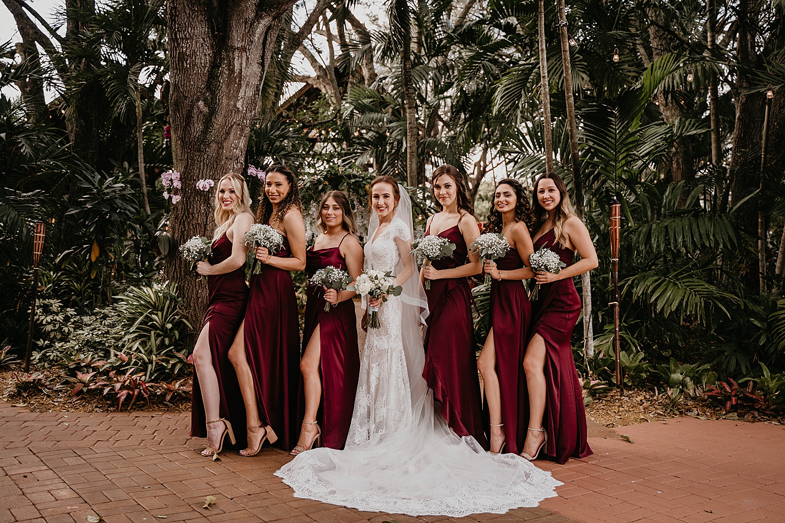 Bride posing with Bridesmaids with white bouquets Living Sculptures Sanctuary Wedding Photography captured by South Florida Wedding Photographer Krystal Capone Photography 
