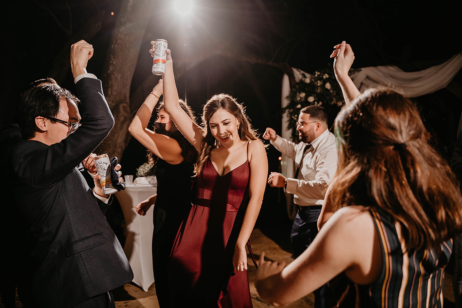 Reception dancing with whiteclaws in hand Living Sculptures Sanctuary Wedding Photography captured by South Florida Wedding Photographer Krystal Capone Photography 