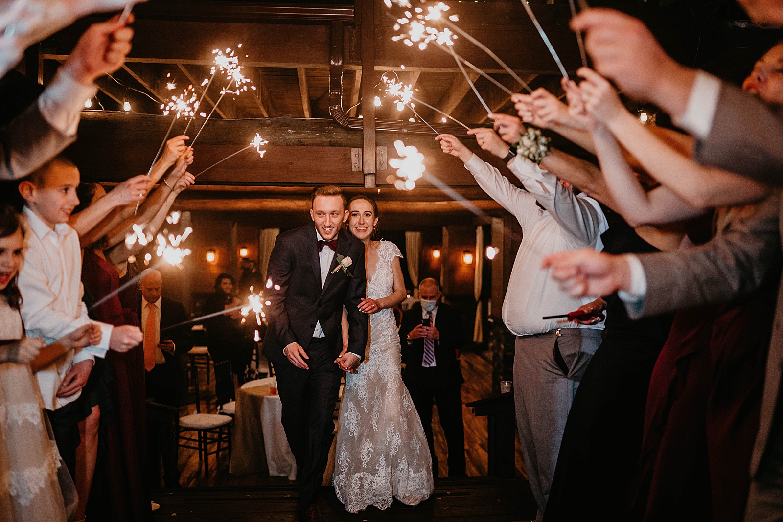 Sparkler exit with Bride and Groom starting to exit Living Sculptures Sanctuary Wedding Photography captured by South Florida Wedding Photographer Krystal Capone Photography 