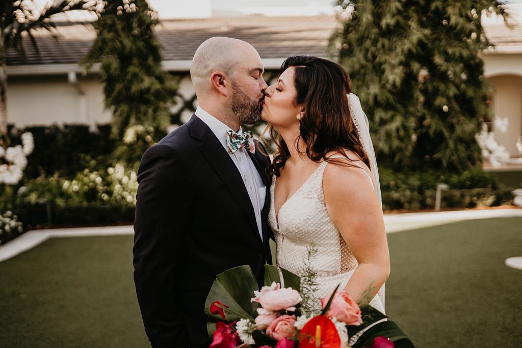 Bride and Groom kissing after first look Pelican Club Wedding Photography captured by South Florida Wedding Photographer Krystal Capone Photography 