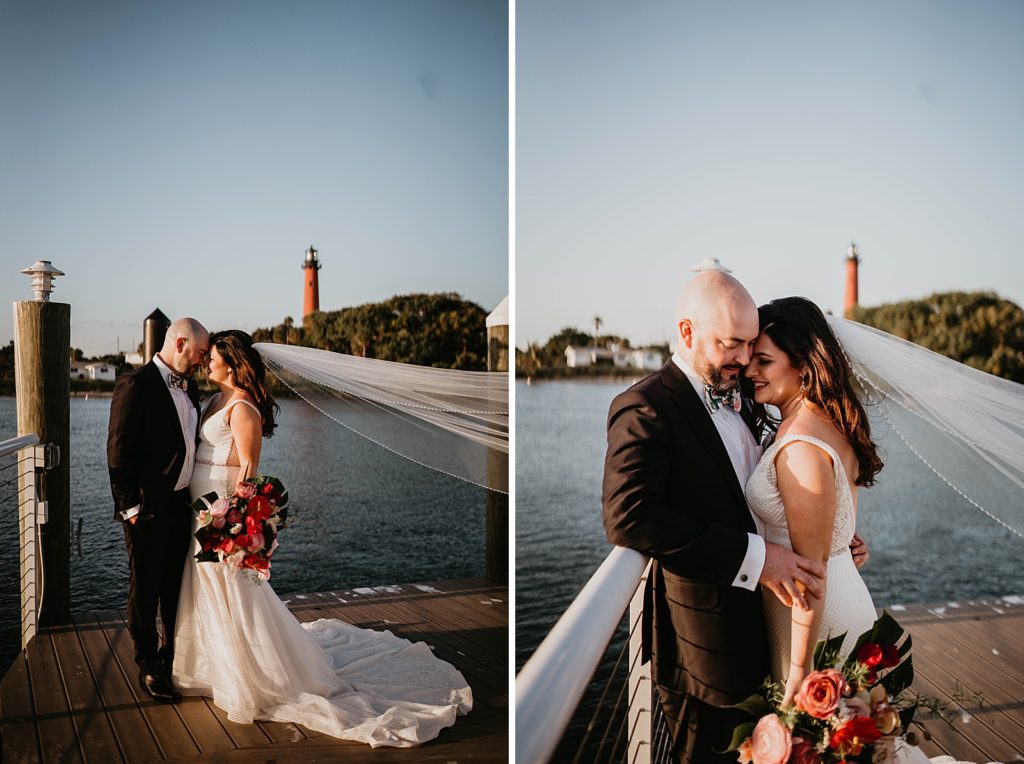 Bride and Groom nuzzling and holding each other on the dock next to the water with the lighthouse behind them Pelican Club Wedding Photography captured by South Florida Wedding Photographer Krystal Capone Photography 
