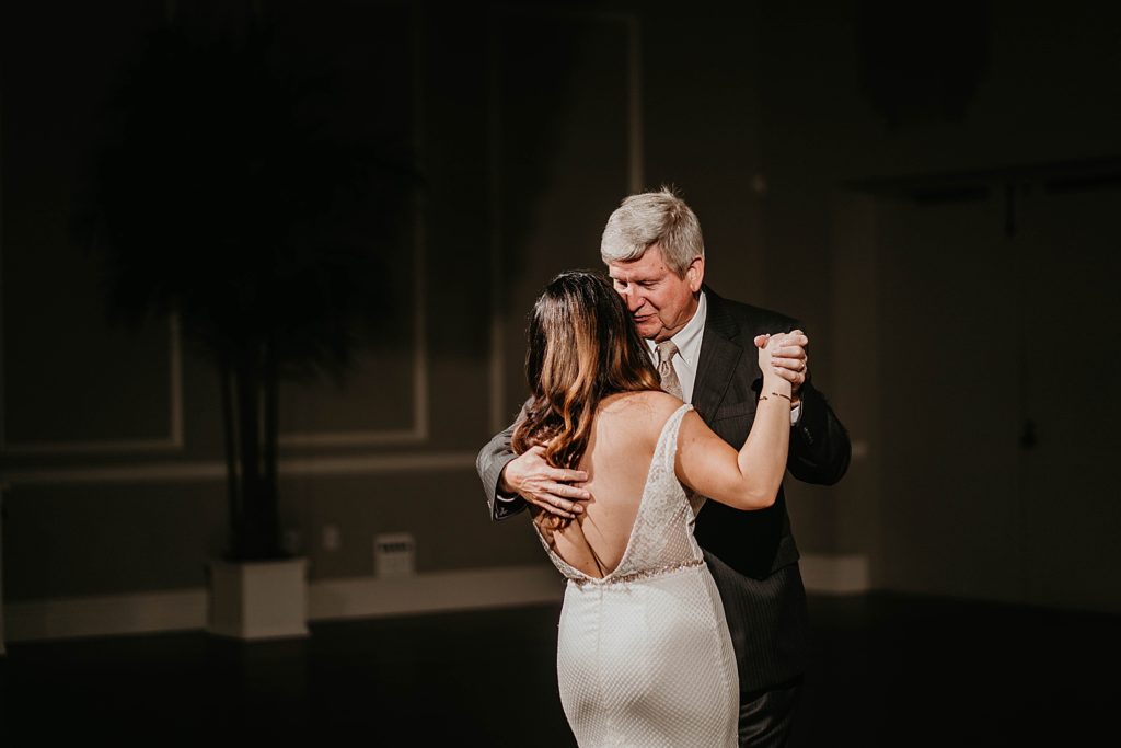 Father daughter dance dim lighting Pelican Club Wedding Photography captured by South Florida Wedding Photographer Krystal Capone Photography 