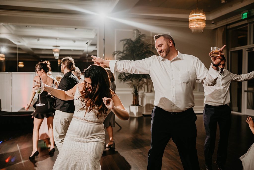 Bride dancing with guests Pelican Club Wedding Photography captured by South Florida Wedding Photographer Krystal Capone Photography 