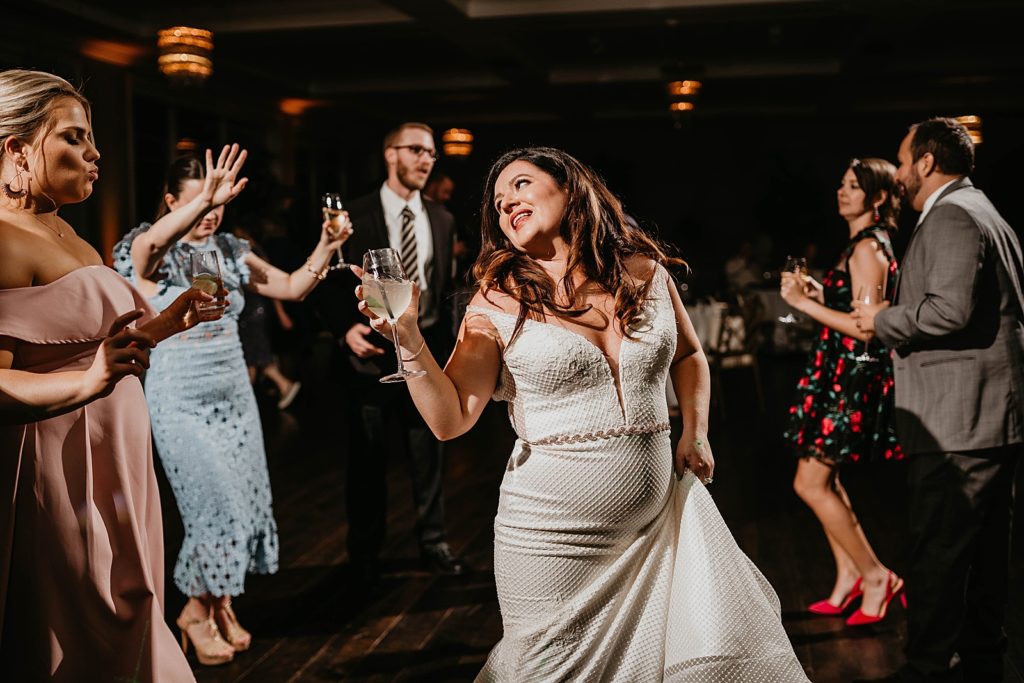 Bride dancing at Reception Pelican Club Wedding Photography captured by South Florida Wedding Photographer Krystal Capone Photography 