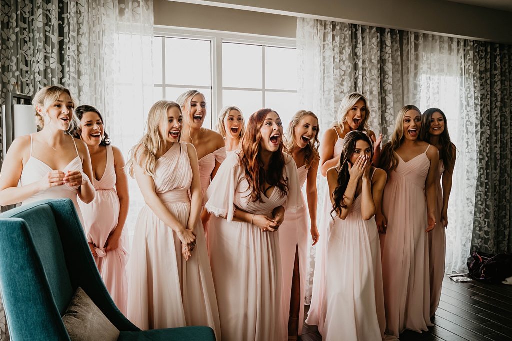 Bridesmaids reaction to Bride in dress Pelican Club Wedding Photography captured by South Florida Wedding Photographer Krystal Capone Photography