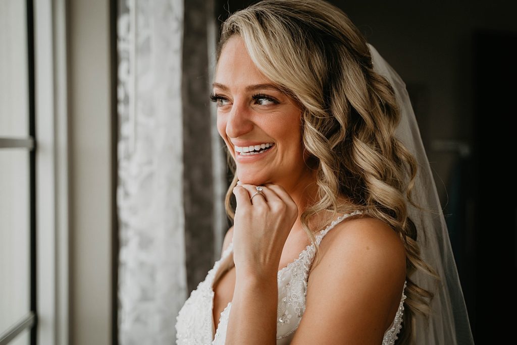 Closeup of Bride excited after getting ready Pelican Club Wedding Photography captured by South Florida Wedding Photographer Krystal Capone Photography