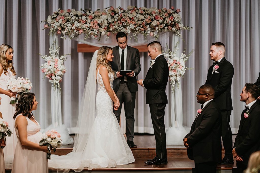Bride and Groom exchanging vows Ceremony Pelican Club Wedding Photography captured by South Florida Wedding Photographer Krystal Capone Photography