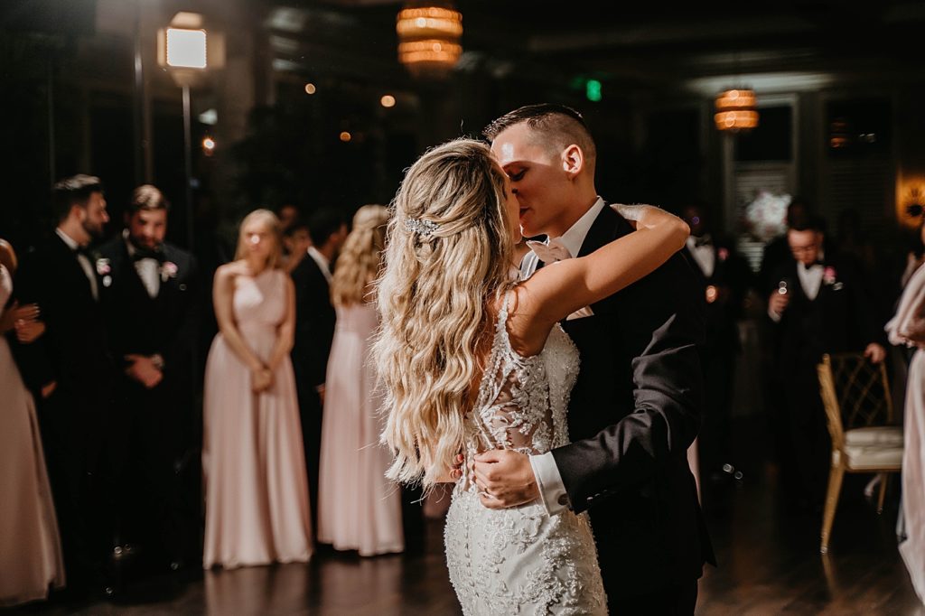 Bride and Groom kissing during first dance Pelican Club Wedding Photography captured by South Florida Wedding Photographer Krystal Capone Photography